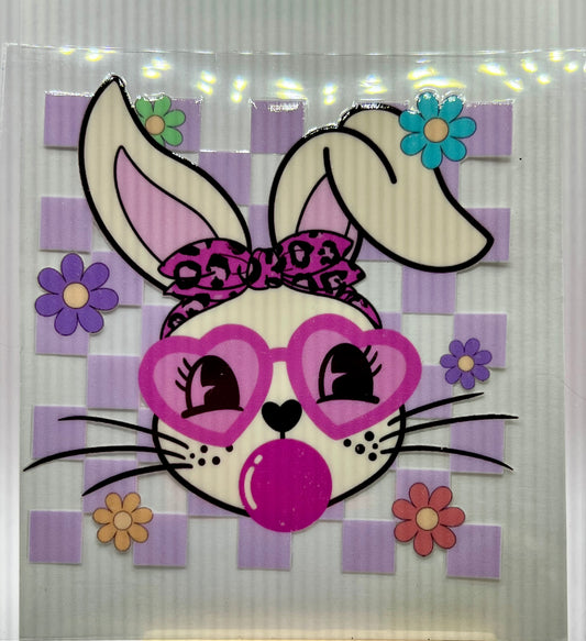 Checked bunny blowing bubble